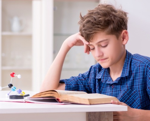 Learning disabled with ADHD kid preparing for school at home.