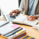 College students studying with books and a laptop.